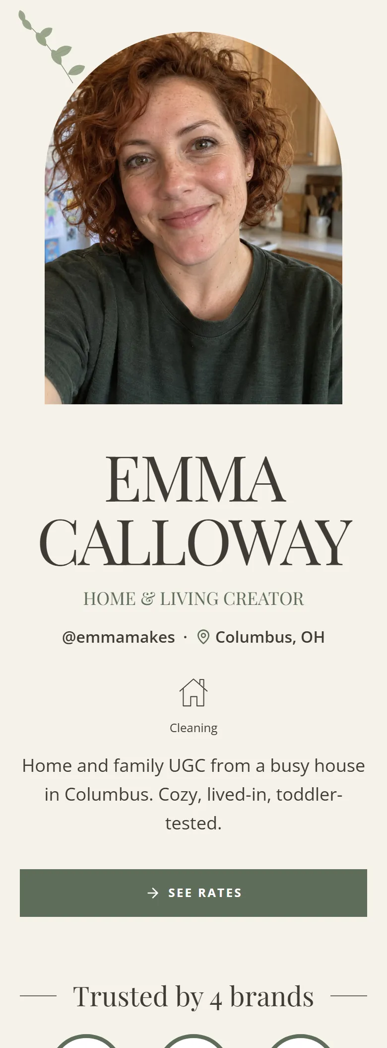 The Botanical layout on a phone, shown on a demo page: serif capitals on cream with leaves and an arched portrait.